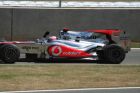 Button acknowledges the applause after the race