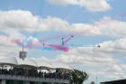 Red Arrows break over the BRDC clubhouse