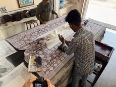 Screen printing fabric by hand